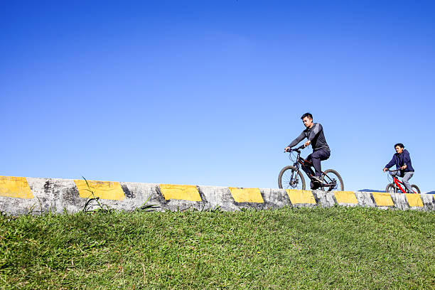 man with a prosthetic leg ride a mountain bike on a hill