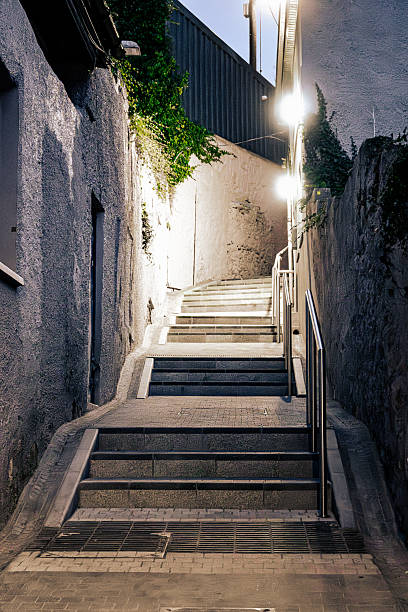 A beautifully picturesque stairway bathed in soft, gentle lights, ascending upwards in a peaceful urban setting