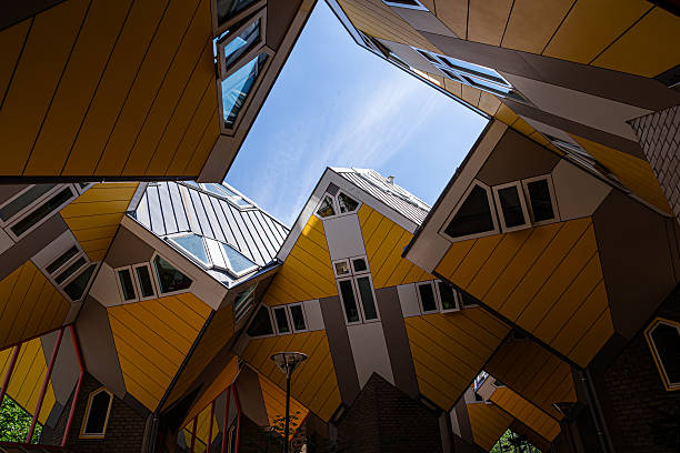 istock Looking Up at Rotterdam Cube Houses Framed by Blue Sky 2227959537