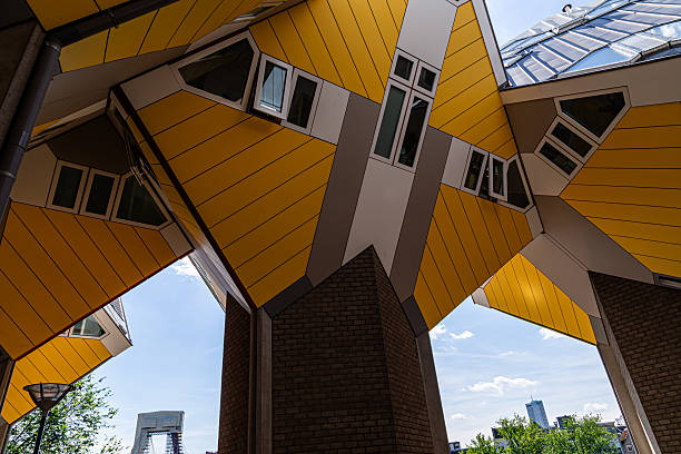 istock Looking Up at Rotterdam Cube Houses Framed by Blue Sky 2227959539