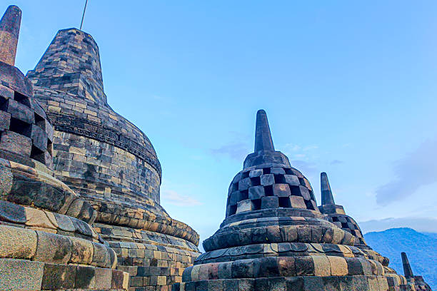 Captivating view of the ancient stone stupas at the Borobudur Temple complex in Indonesia, showcasing the unique architecture and serene atmosphere of this historic site.