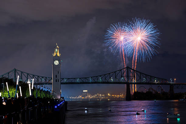 istock Montreal Clock Tower and Jacques Cartier Bridge with fireworks at night during summer celebration. g 2227968243
