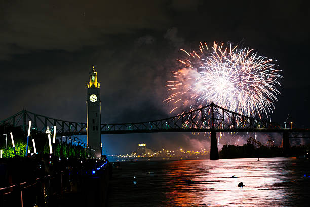 istock Montreal Clock Tower and Jacques Cartier Bridge with fireworks at night during summer celebration. g 2227968492