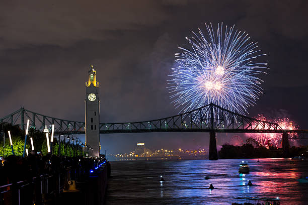 istock Montreal Clock Tower and Jacques Cartier Bridge with fireworks at night during summer celebration. g 2227968618