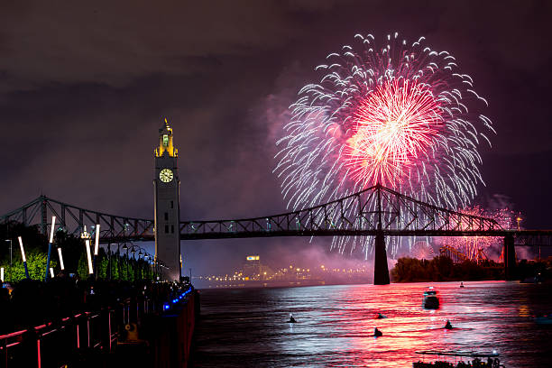 istock Montreal Clock Tower and Jacques Cartier Bridge with fireworks at night during summer celebration. g 2227968666
