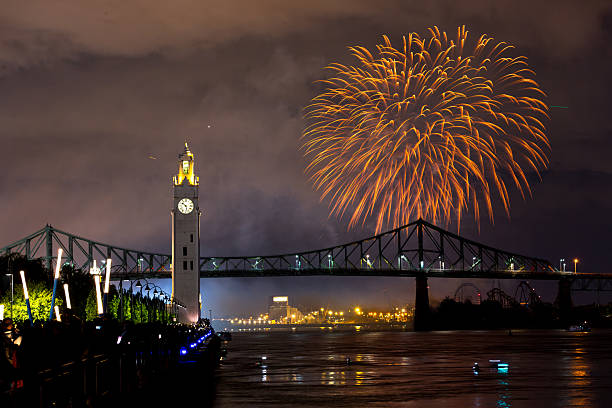 istock Montreal Clock Tower and Jacques Cartier Bridge with fireworks at night during summer celebration. g 2227969483