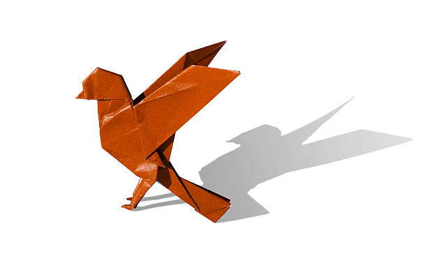 Orange Origami Bird Robin isolated on white