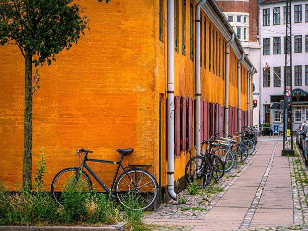 istock Yellow row houses with red shutters line Borgergade in Nyboder, Copenhagen, Denmark 2227972007