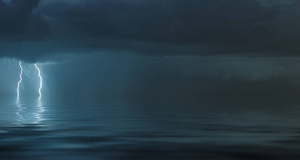istock lightning bolts reflection over the sea 2227974126