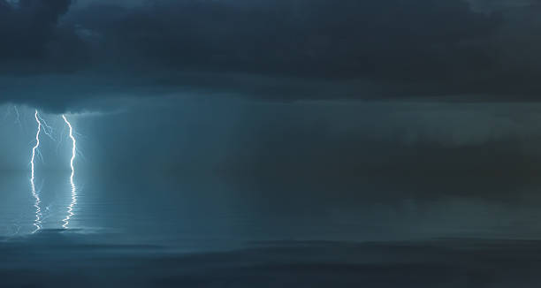 istock lightning bolts reflection over the sea 2227974834