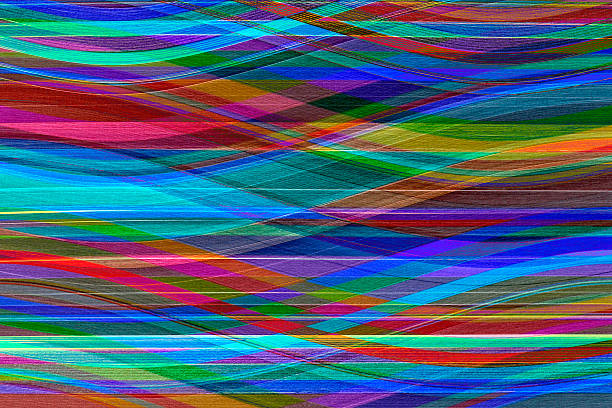 Close-up of multicolored paper curved stripes abstract forming background.