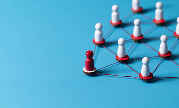 istock Wooden human figures connected by glowing thread  HR network and team connectivity
 on blue Background 2227982180