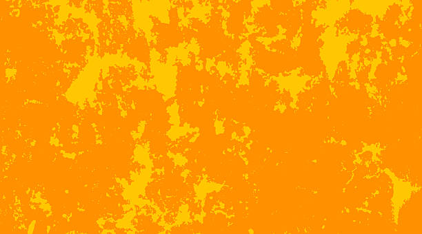 A bold grunge wall texture with distressed orange and yellow tones, evoking a rustic and weathered surface ideal for abstract backgrounds or design overlays.
