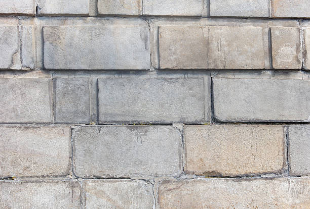 istock A brick wall with a few cracks in it 2227982967