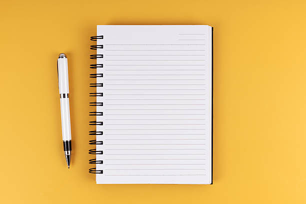 istock Flat lay view of a notebook and a pen. 2227986687
