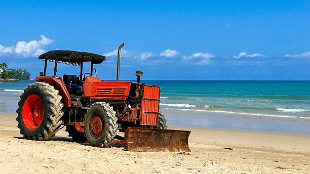 istock Old red tractor on the seashore, Phuket, Thailand 2227987655