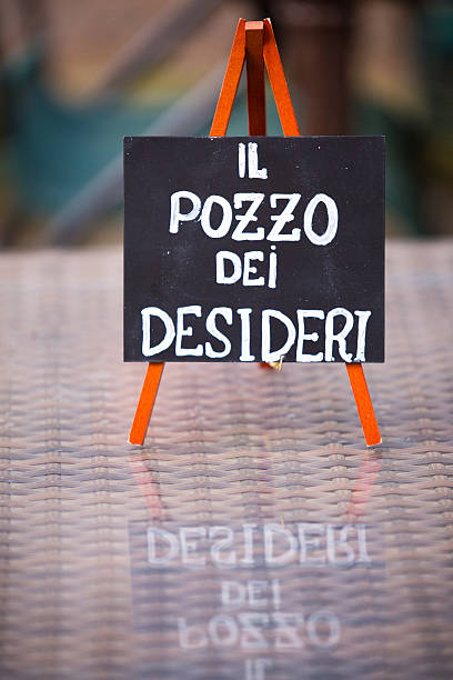 istock A sign placed on an easel that reads il pozzo dei desideri 2227990897