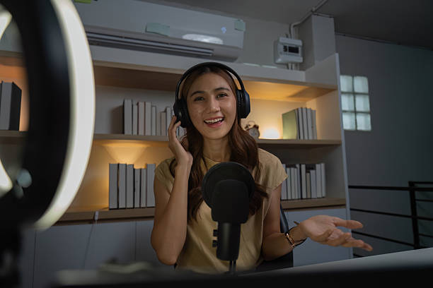 istock Virtual Meeting and Remote Work. Smiling woman using headphones during online discussion. 2227990958