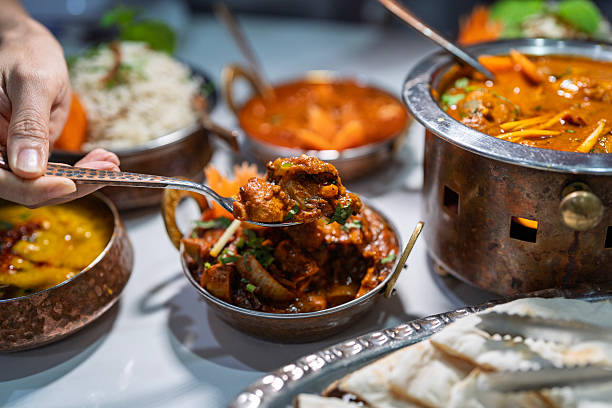 istock Serving Spicy Mutton Curry at Indian Restaurant 2227991078