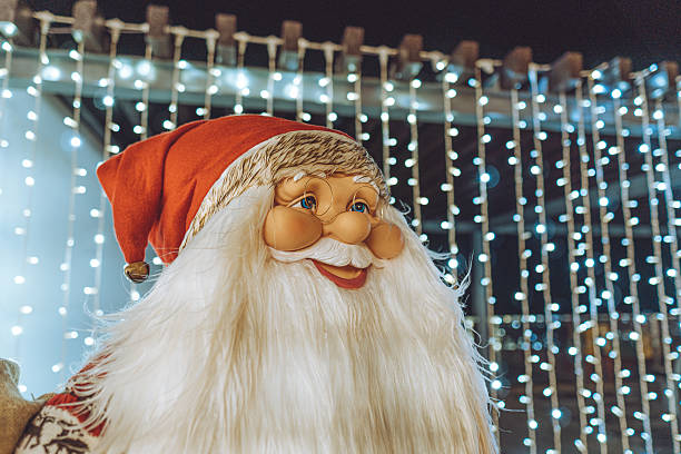 istock Santa Claus Doll, Life Size, with beautifull light strips behing it. 2227991190