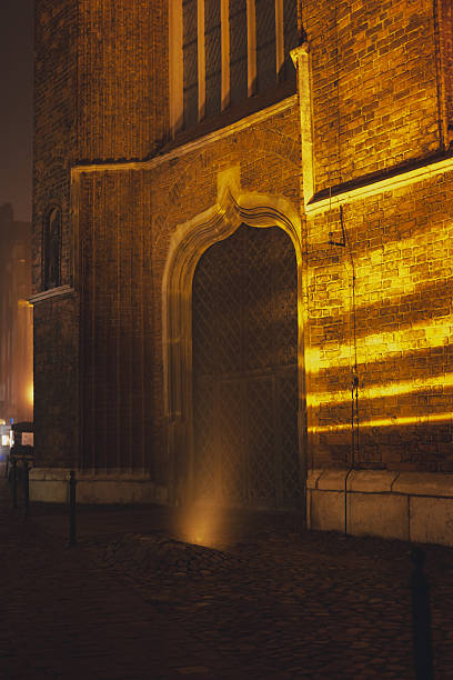 Illuminated Gothic Brick Building at Night in Gdansk