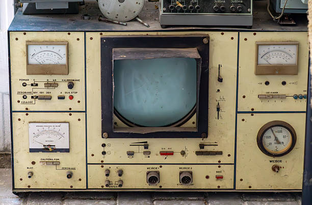 istock Old analog measuring device with a cathode-ray tube and dial indicators, covered in dust, surrounded by laboratory equipment. 2227991976