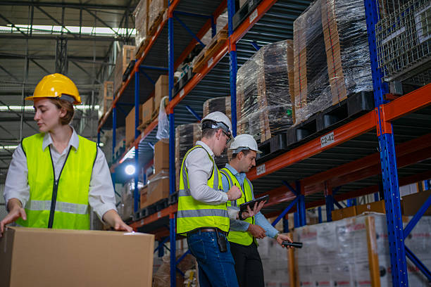 istock Blue collar workers are working and meeting at warehouse. 2227992404