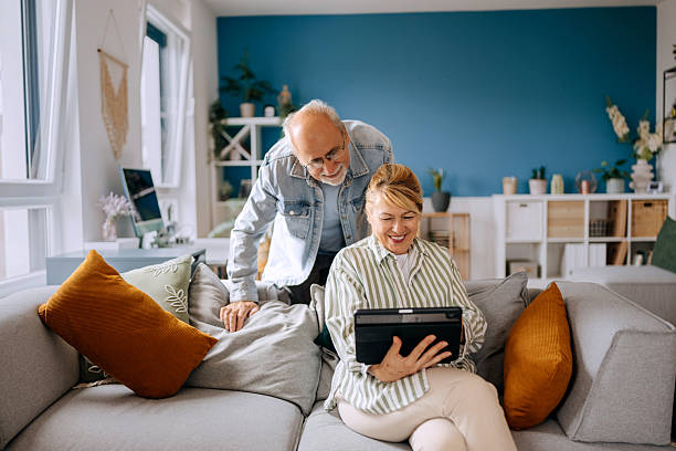 istock Senior couple using digital tablet for a video call with family 2227994632