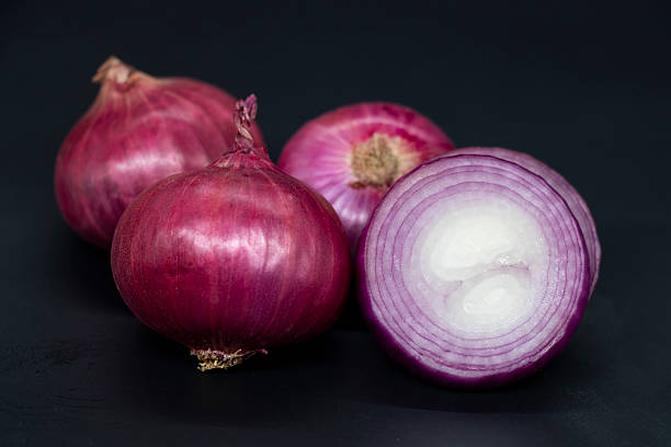istock Whole and sclice Slice Onion, isolated on black background. 2227996031