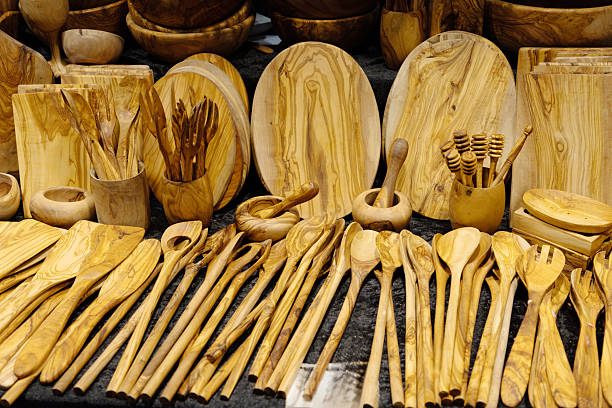 istock Wooden kitchen utensils and serving dishes arranged beautifully on a textured surface for culinary use 2227997330