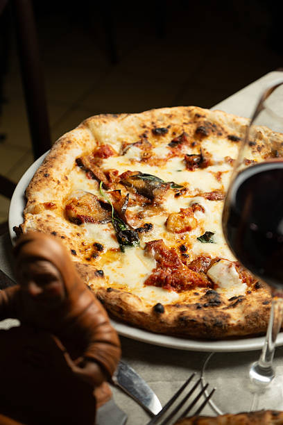 istock White pizza with eggplant on a plate at the restaurant 2228000237