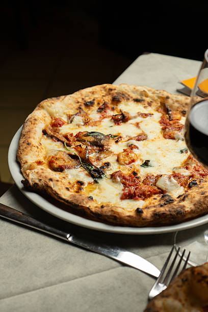 istock White pizza with eggplant on a plate at the restaurant 2228000246