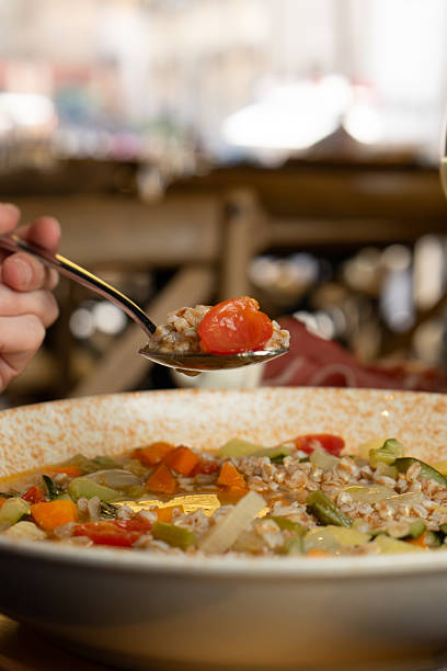 istock Farro soup with vegetables in a bowl at the restaurant 2228001624