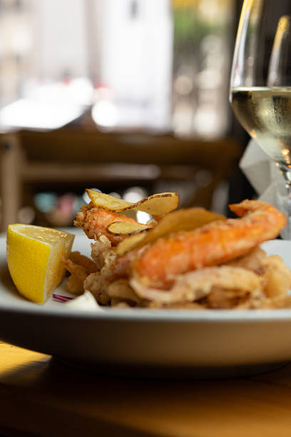 istock Fried prawns with chips, lemon and mayonnaise 2228001704