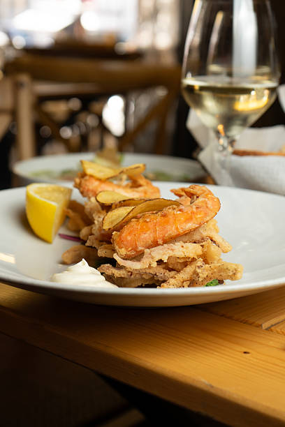 istock Fried prawns with chips, lemon and mayonnaise 2228001705