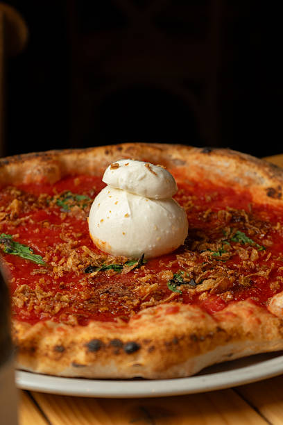 istock Tomato pizza with burrata on a plate at the restaurant 2228001855