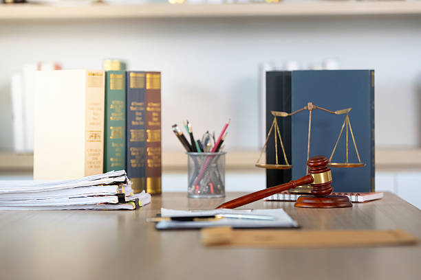 istock Legal Workspace. Professional law office with documents and gavel on the table. 2228004504
