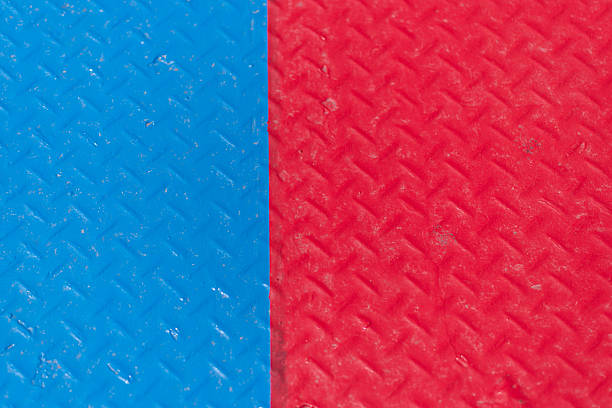 Outdoor basketball sport court line marking with non-slip plastic surface as abstract background, selective focus