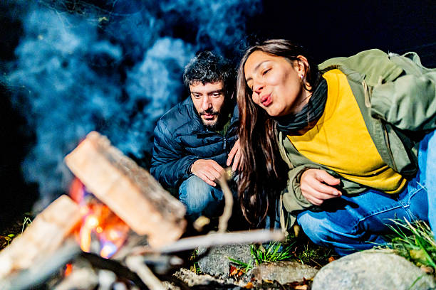 Severe Cold Wave, People warming themselves around a small fire. People trying to escape the winter in gujarat india. People sit around fire to keep them warm during chilled weather in the city.