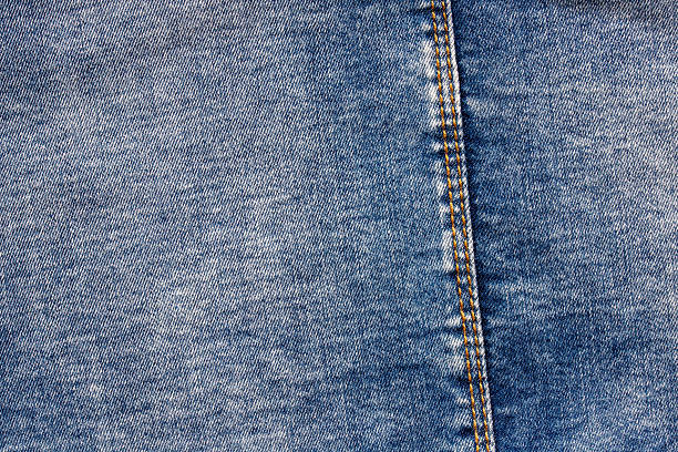 istock texture of blue jeans denim fabric with seam background 2228011283