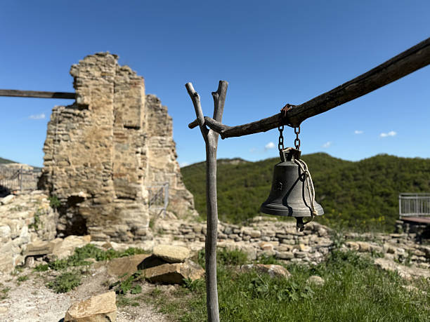Part of San Pedro Church facade, cattail and bell, front view,  Muros village, A Coruña province, Galicia, Spain.  Rías Baixas. Cattail, rose window.