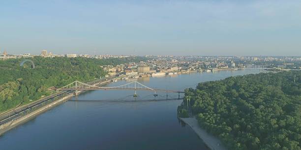 istock Wide river in city with bridge. Cityscape architecture 2228015377