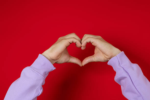 istock Male hand making heart gesture with his hand 2228016413