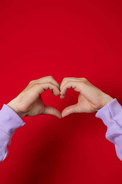 istock Male hand making heart gesture with his hand 2228016457