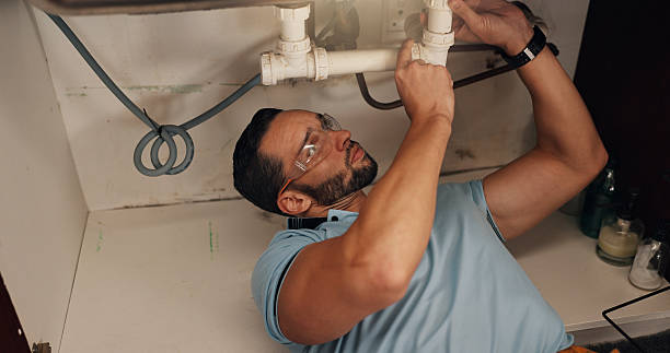 istock Man, plumber and assessment in kitchen, pipe and sink with search for leak, problem solving and repair in home. Person, handyman and check for water, drain and solution for maintenance at apartment 2228023616
