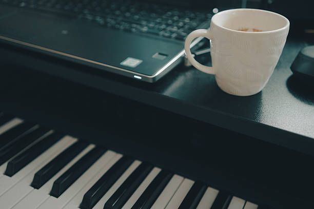 istock Relaxing with coffee next to laptop and keyboard 2228023915
