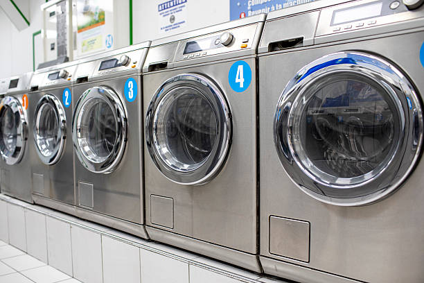 istock Washing machines in a row in a launderette 2228027951