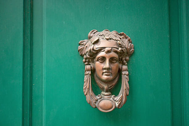 Attractive senior hispanic woman standing against old studded door