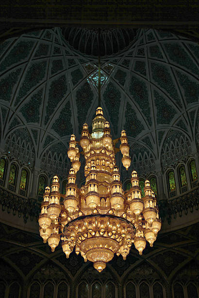 istock Luxurious chandelier hanging from a richly decorated dome ceiling in a mosque 2228032263