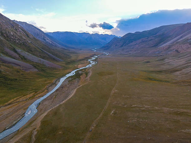 istock A river flowing through a vast mountain valley at dusk 2228033509